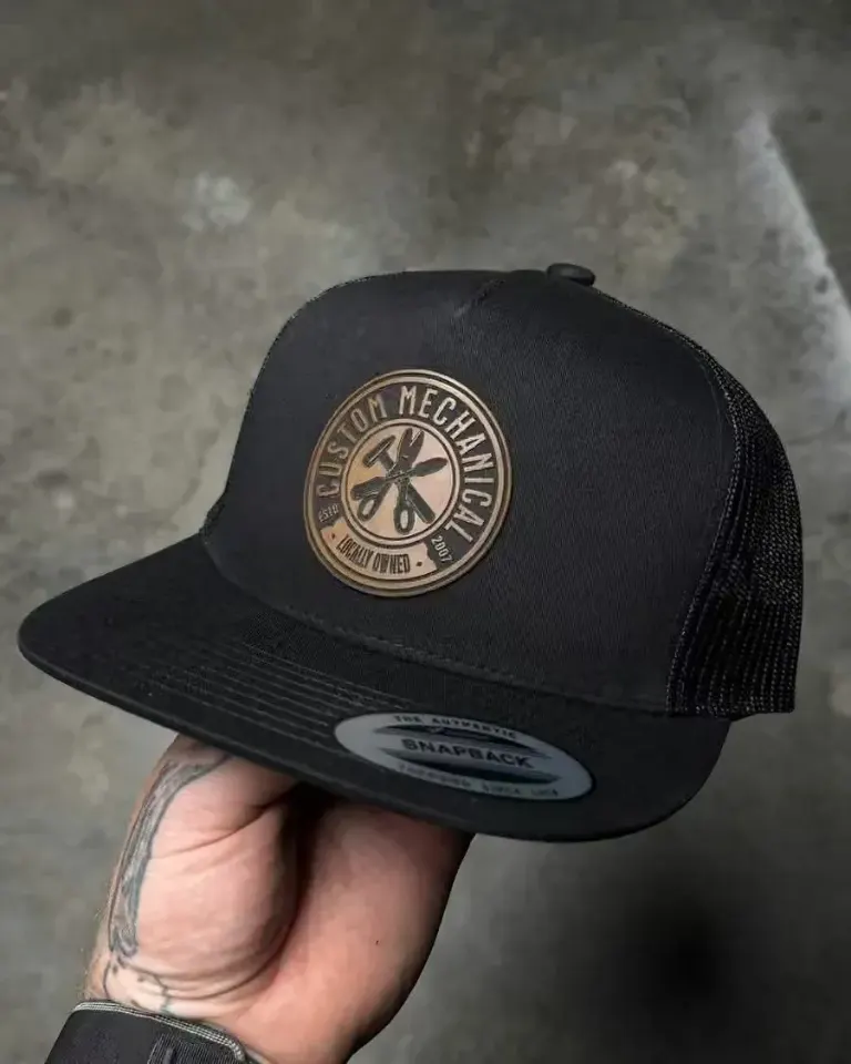 Black trucker hat with a leather Custom Mechanical Heating patch