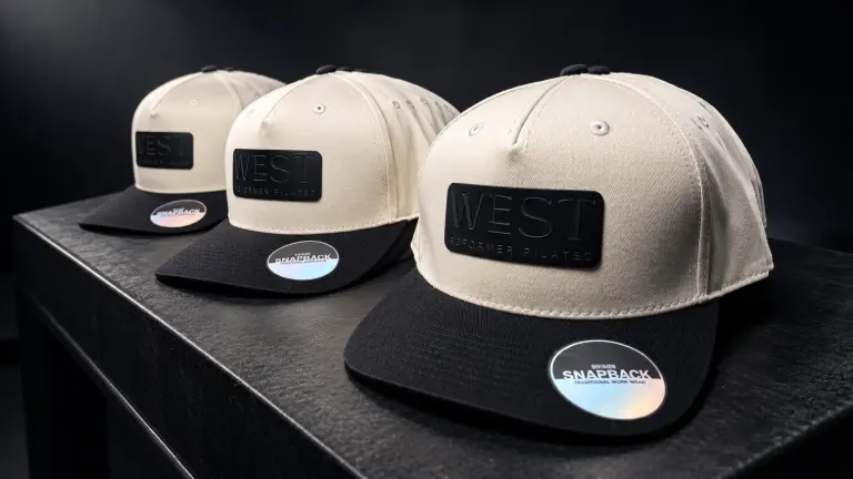 West Reformer Pilates branded hats
